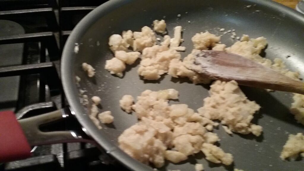 Adding flour to onions